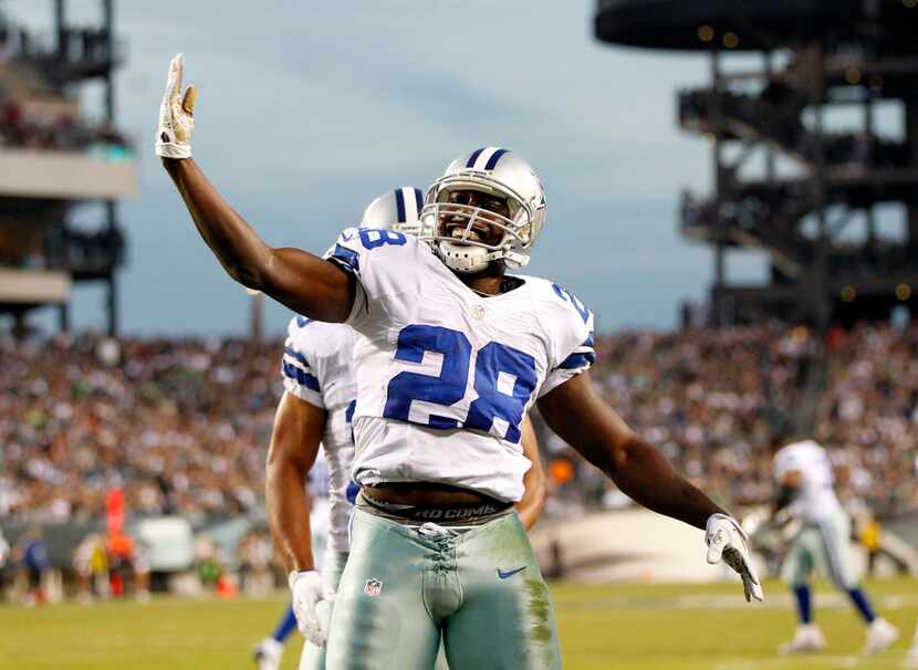 Dallas Cowboys running back Felix Jones (28) celebrates a touchdown in a game against the...