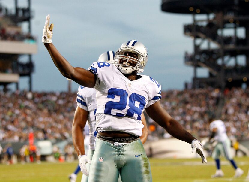 Dallas Cowboys running back Felix Jones (28) celebrates a touchdown in a game against the...