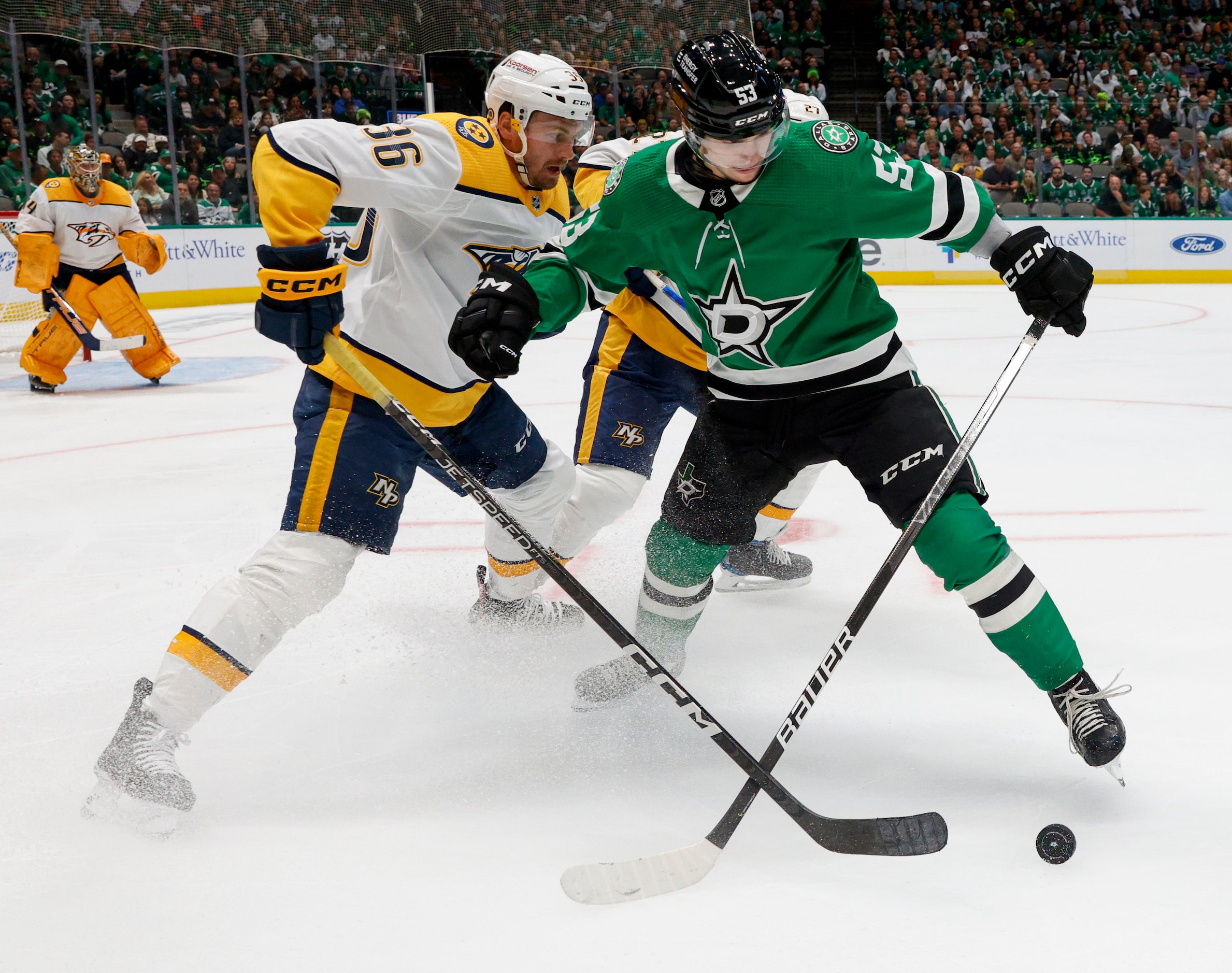 Dallas Stars center Wyatt Johnston (53) holds off Nashville Predators left wing Cole Smith...