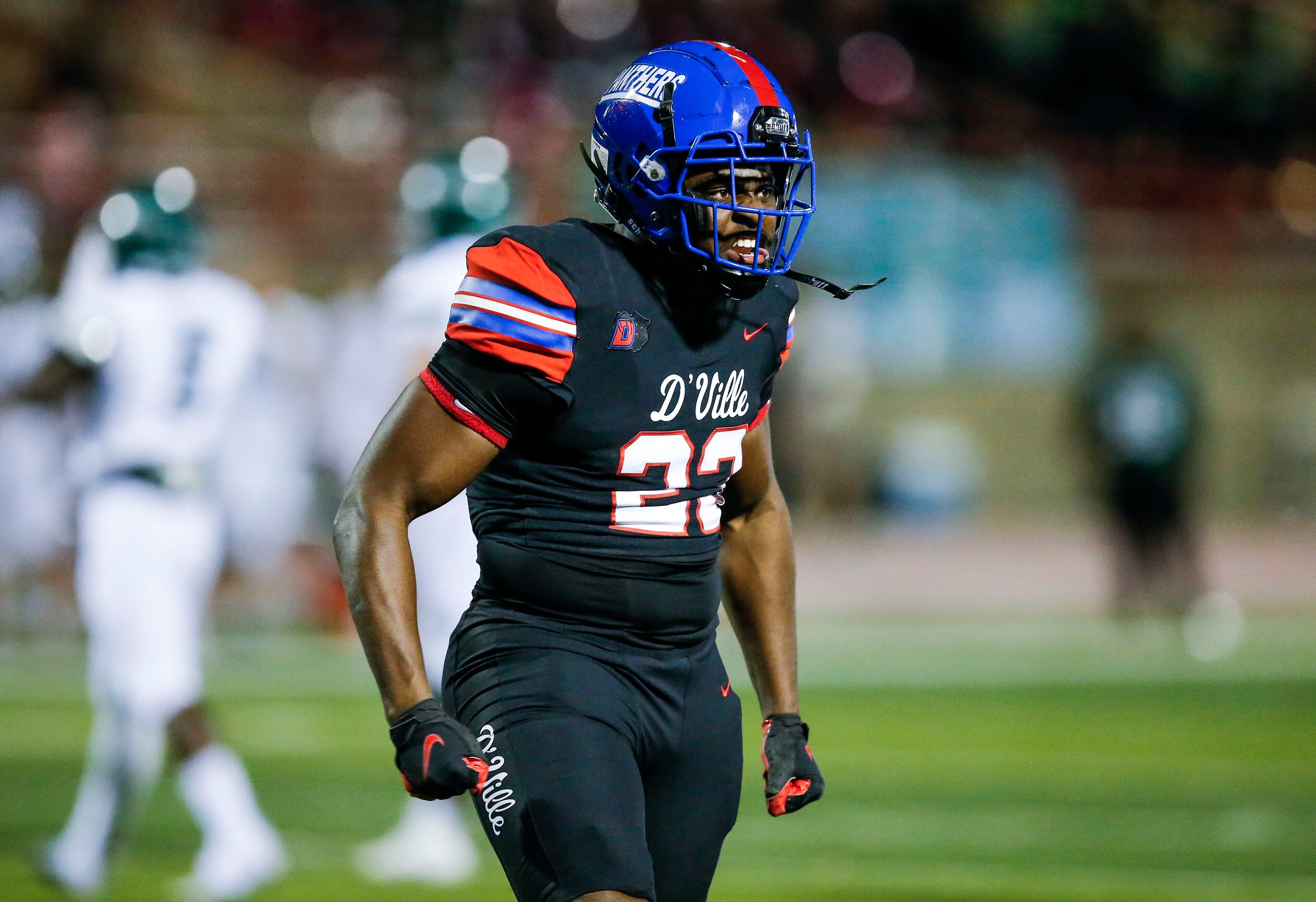 Duncanville senior defensive lineman Omari Abor (23) celebrates a Waxahachie fumble and...