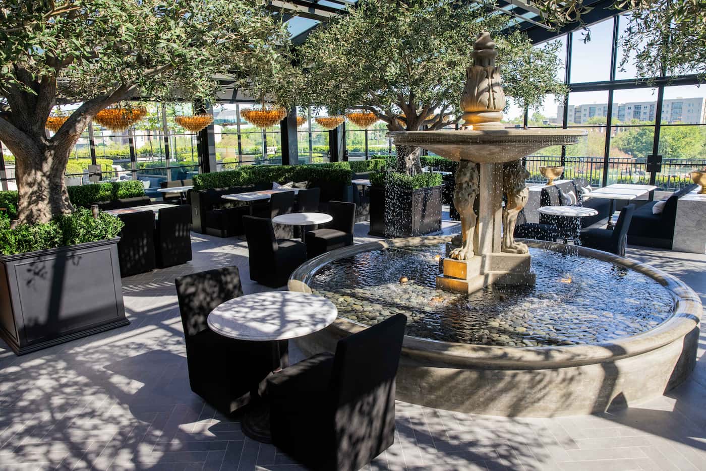 The dining area of the RH restaurant has fountains and French doors.