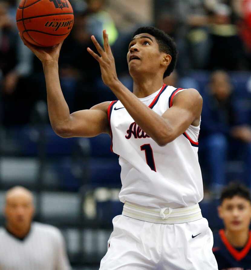 Allen forward Cam Christon (1) goes up for a lay up in the first quarter as Allen High...