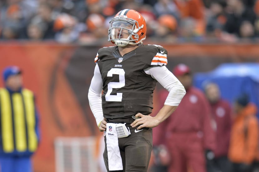 FILE - In this Dec. 14, 2014, file photo, Cleveland Browns quarterback Johnny Manziel reacts...