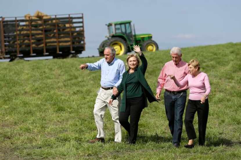 
Former Secretary of State Hillary Rodham Clinton walks with U.S. Sen. Tom Harkin, former...