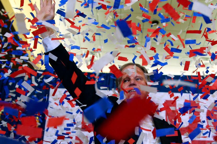 Democrat Doug Jones celebrated his victory Tuesday night in Birmingham, Ala. (John...