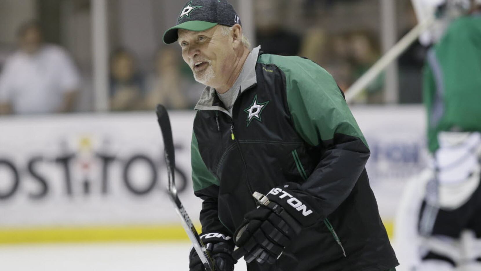 Dallas Stars head coach Lindy Ruff skates the ice during team practice in preparation of...