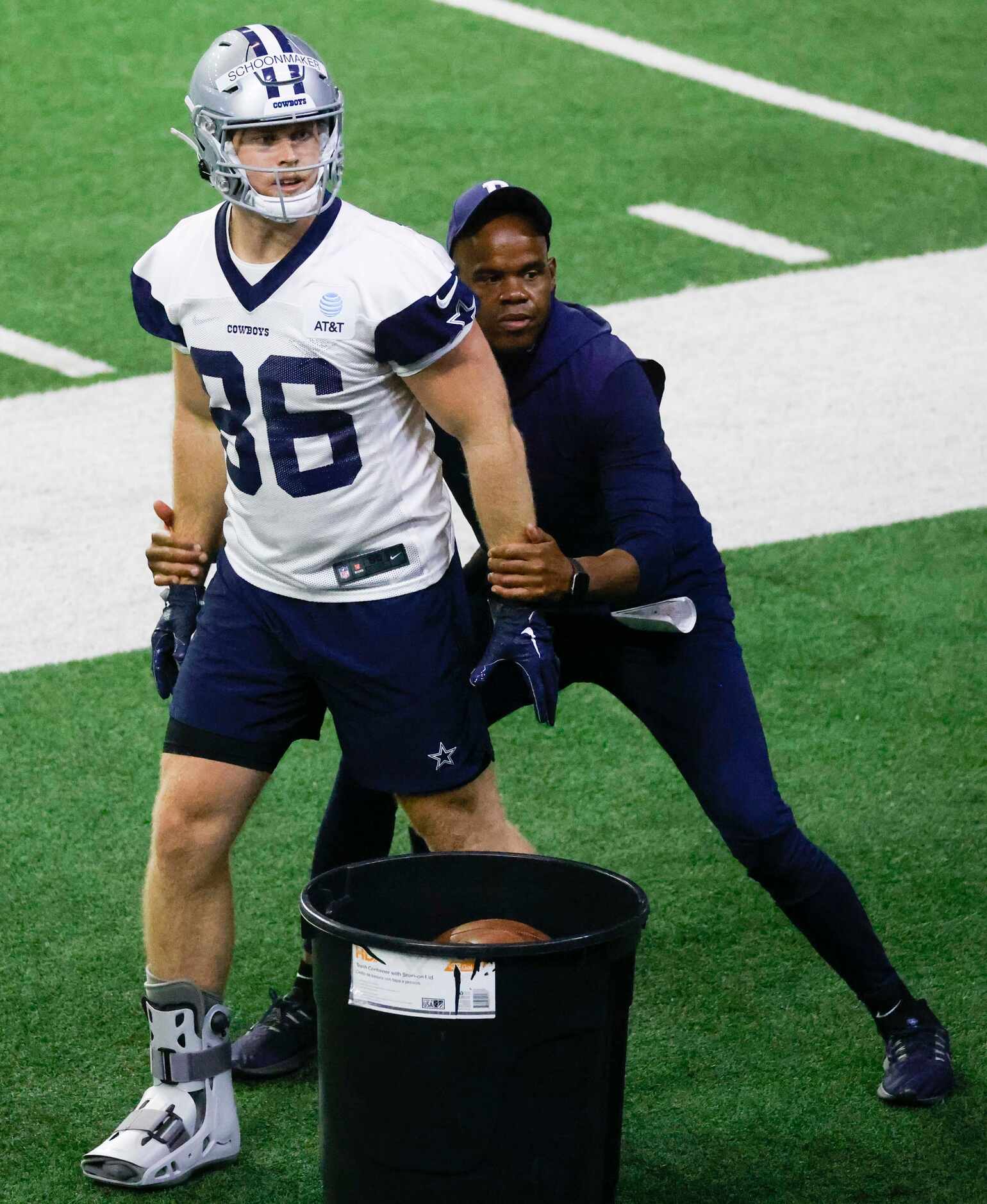 Dallas Cowboys tight end Luke Schoonmaker practices with tight ends coach Lunda Wells during...