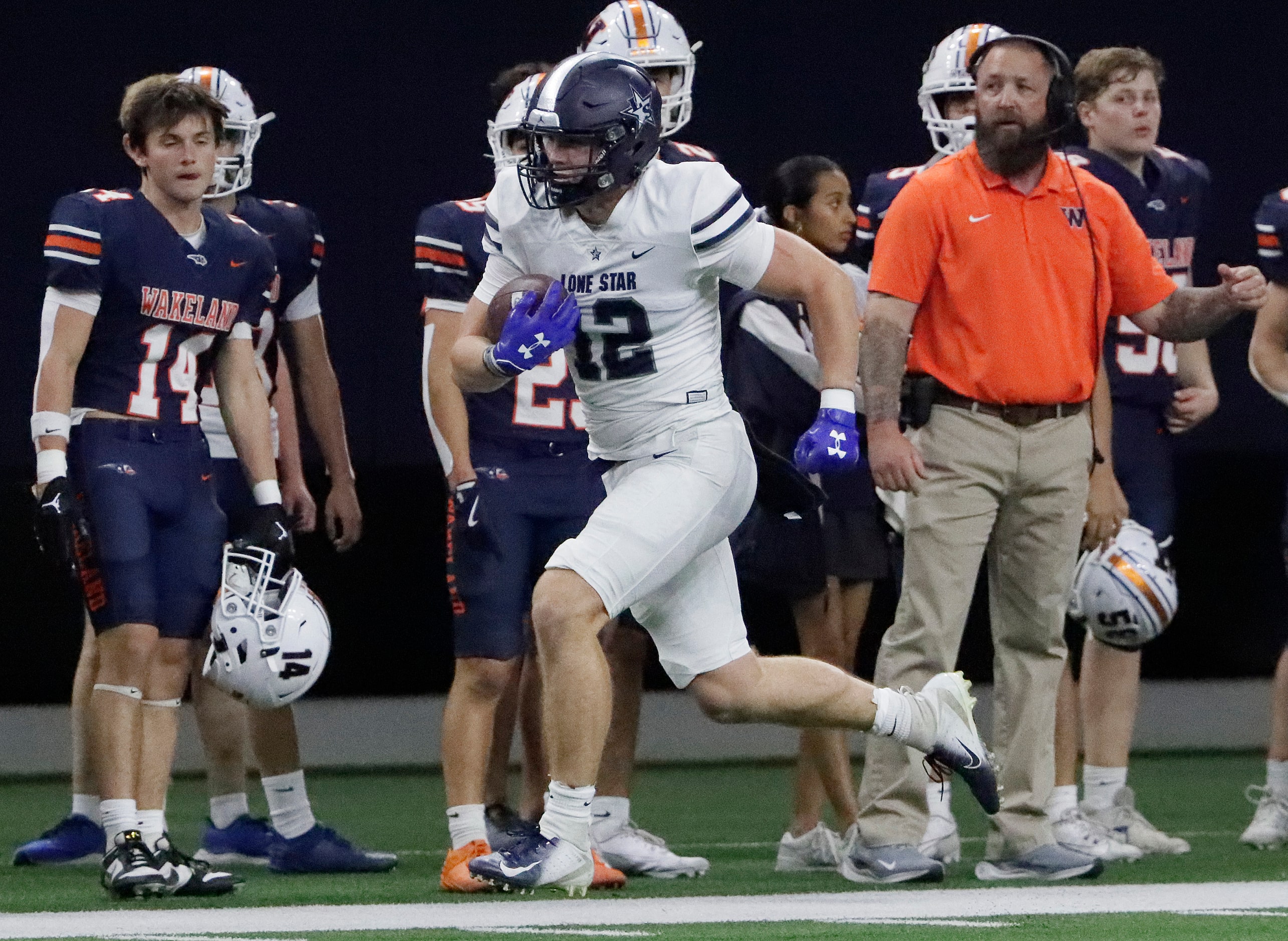 Lone Star High School tight end Ryder Mix (12) makes a long run after the catch during the...