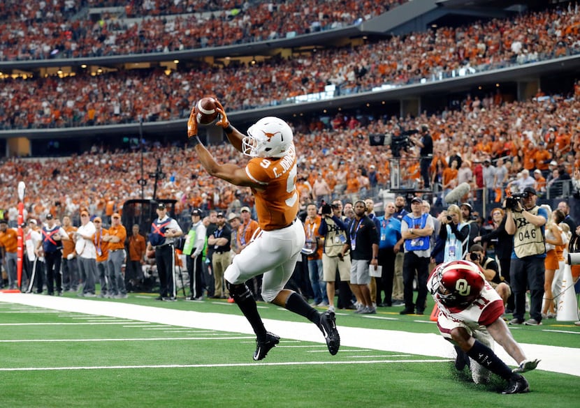 Texas Longhorns wide receiver Collin Johnson (9) is wide open in the end zone but drops the...