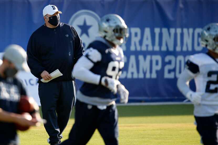 Dallas Cowboys head coach Mike McCarthy watches the team practice during the first day of...