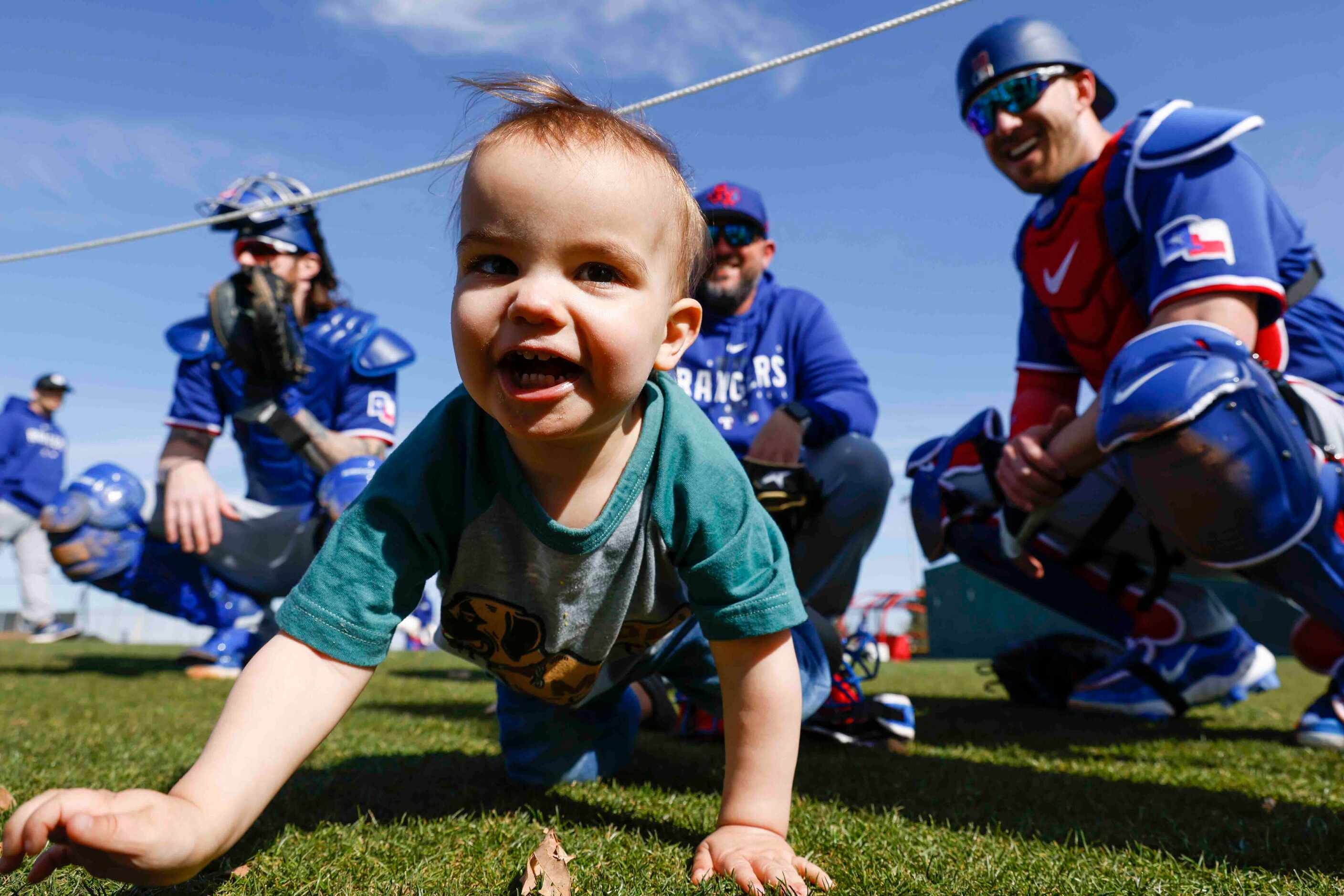 Gamble Garver, 19 month old, plays with his father Texas Rangers pitcher Mitch Garver,...