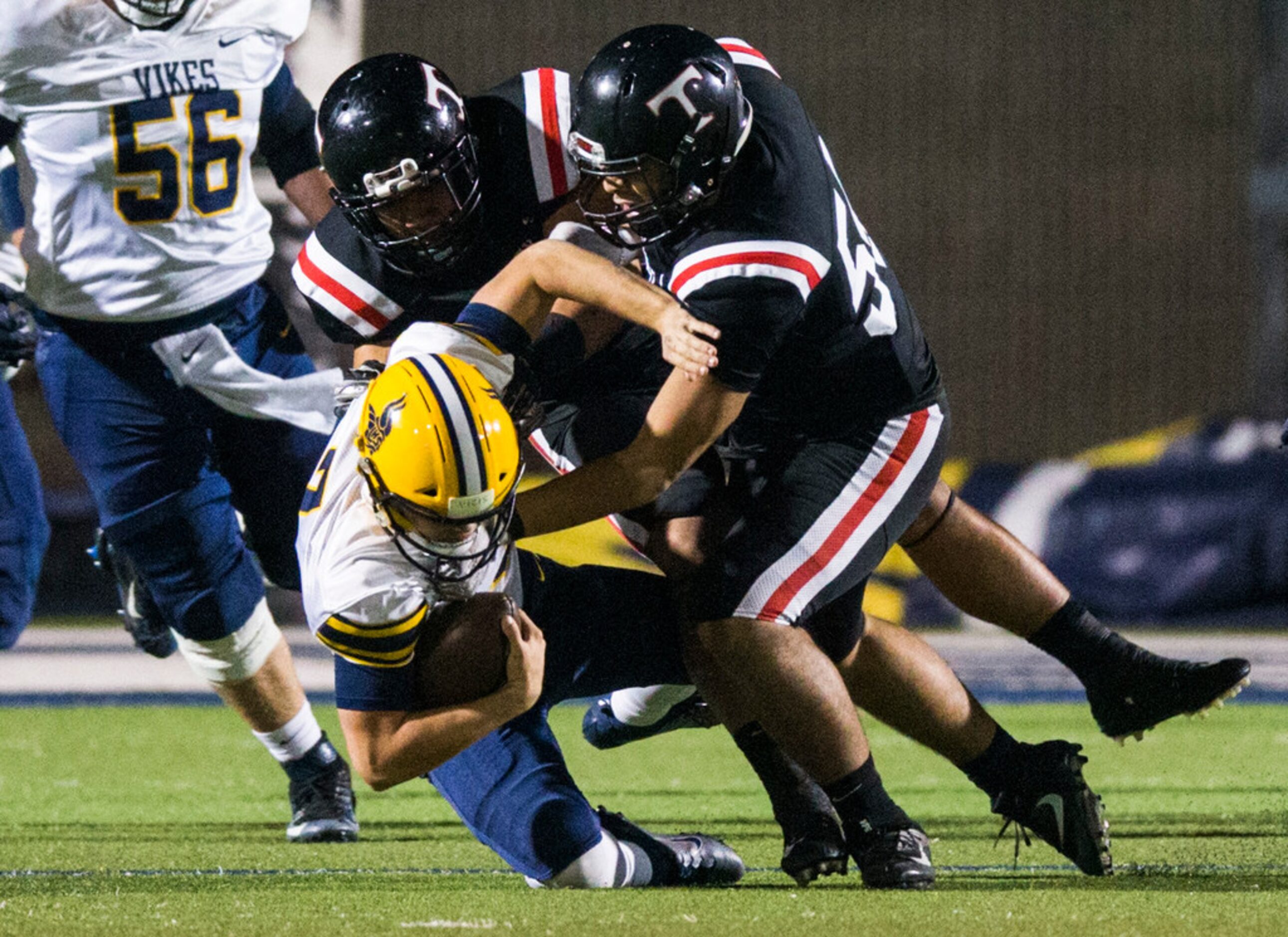 Arlington Lamar quarterback Jack Dawson (7) is sacked by Euless Trinity linebacker Zion...