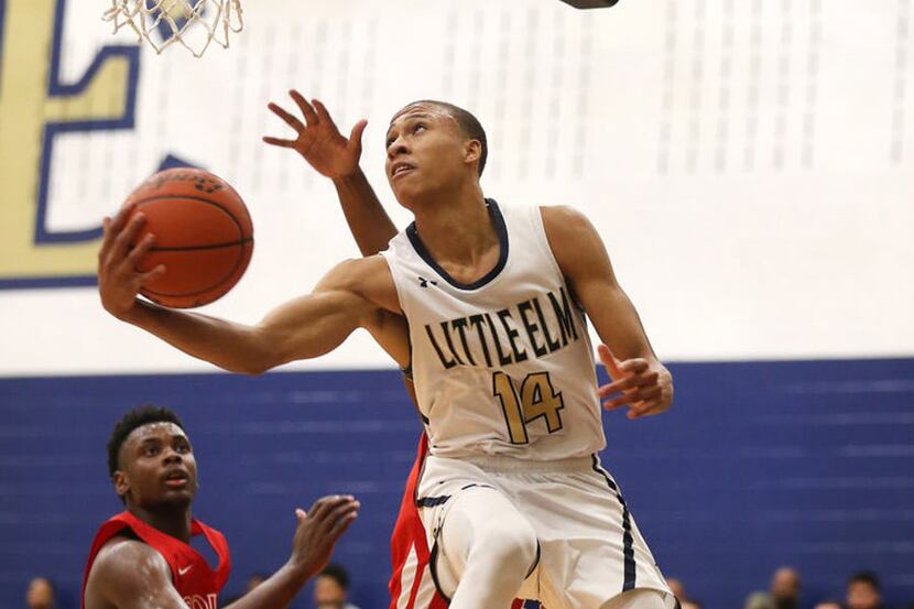 FILE - RJ Hampton scores on South Garland during the third quarter of a game at Little Elm...