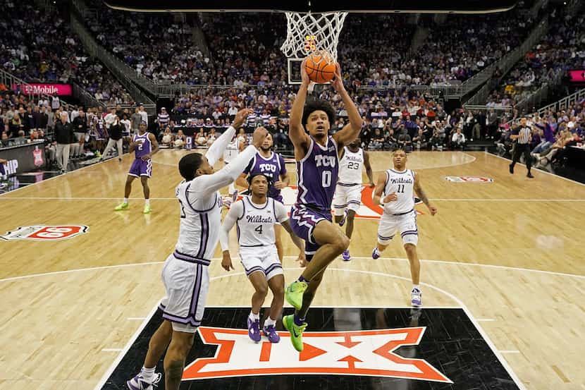 TCU guard Micah Peavy (0) puts up a shot during the first half of an NCAA college basketball...