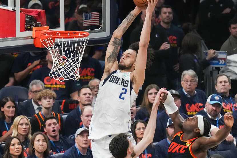 Dallas Mavericks center Dereck Lively II (2) dunks the ball past Oklahoma City Thunder guard...