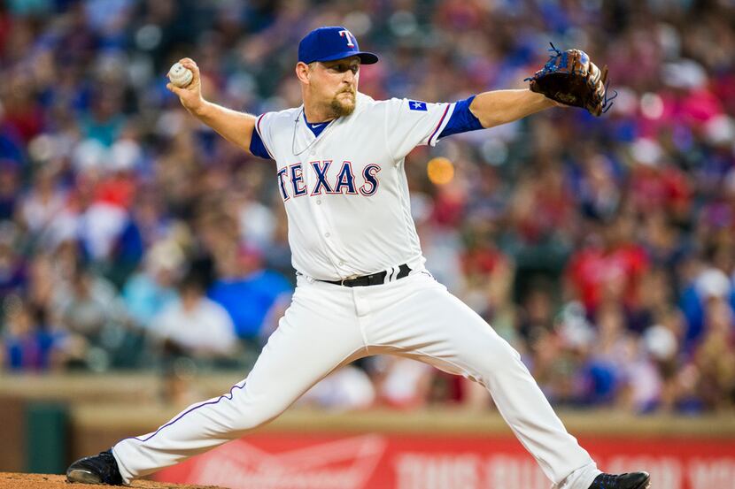 Texas Rangers relief pitcher Austin Bibens-Dirkx (56) pitches during the fifth inning of an...
