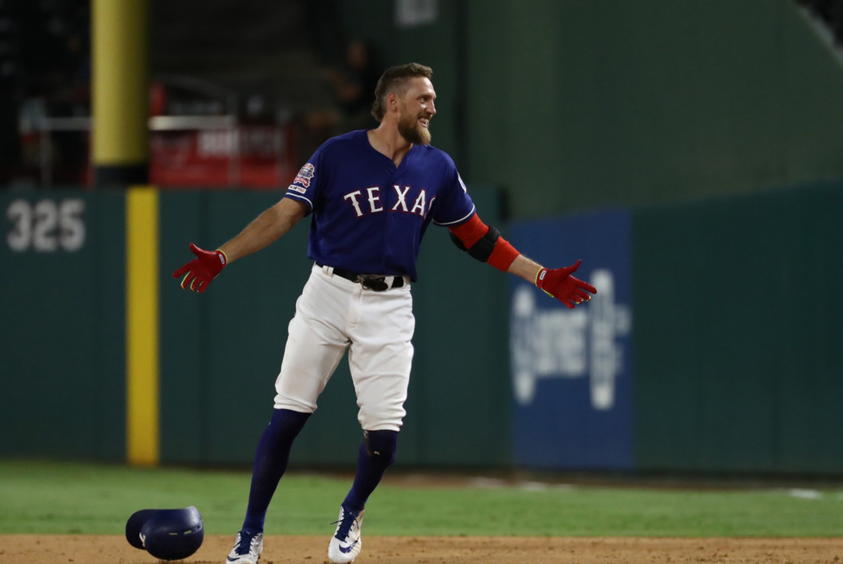 ARLINGTON, TEXAS - AUGUST 21:  Hunter Pence #24 of the Texas Rangers celebrates a walk off...