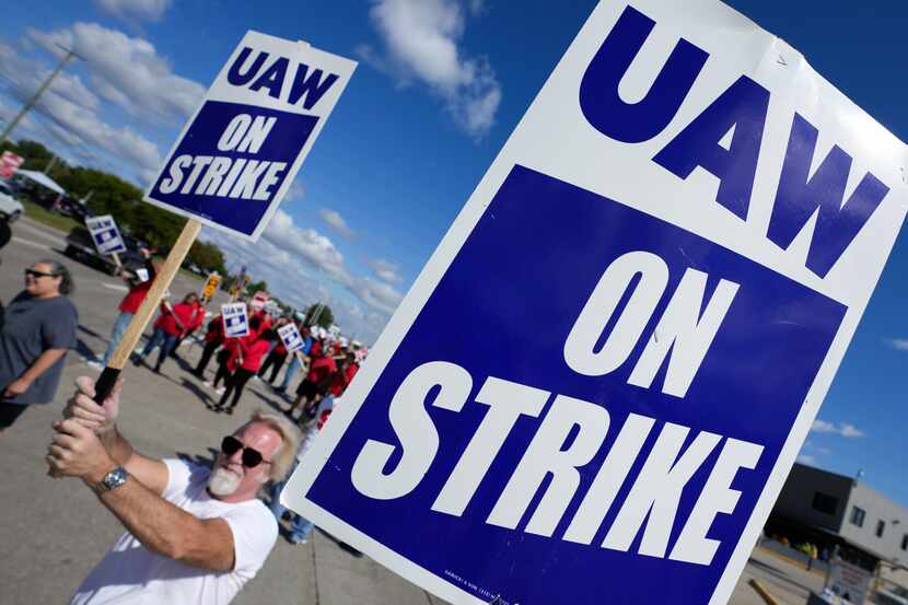 United Auto Workers members walk the picket line this week at the Ford Michigan Assembly...