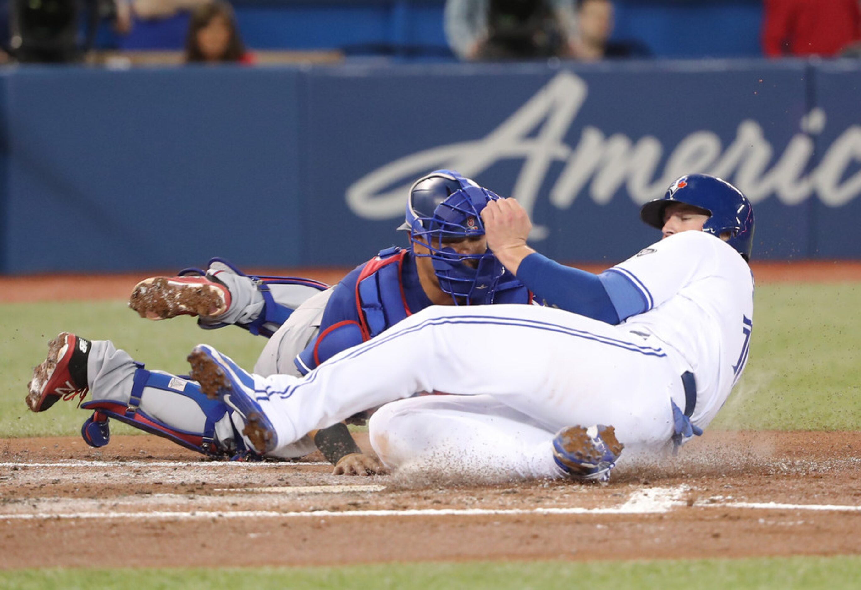 TORONTO, ON - APRIL 27: Justin Smoak #14 of the Toronto Blue Jays is tagged out at home...