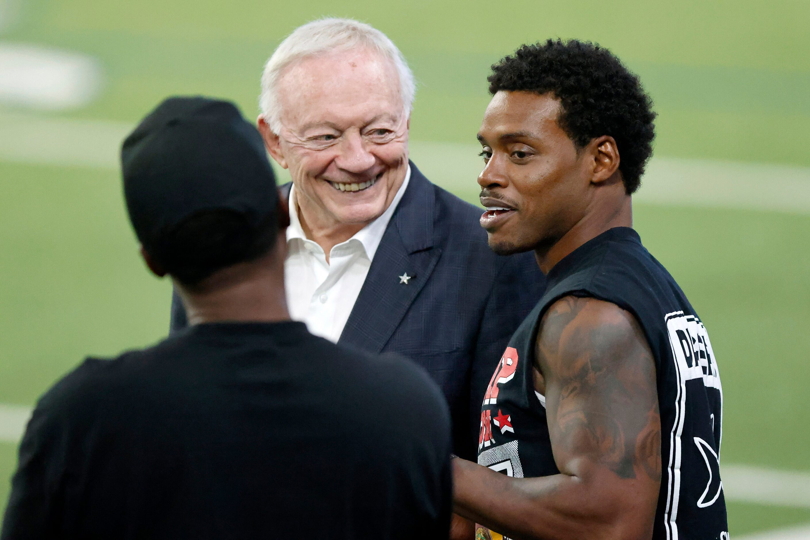 Dallas Cowboys owner Jerry Jones (center) visits with professional boxer Errol Spence Jr. of...