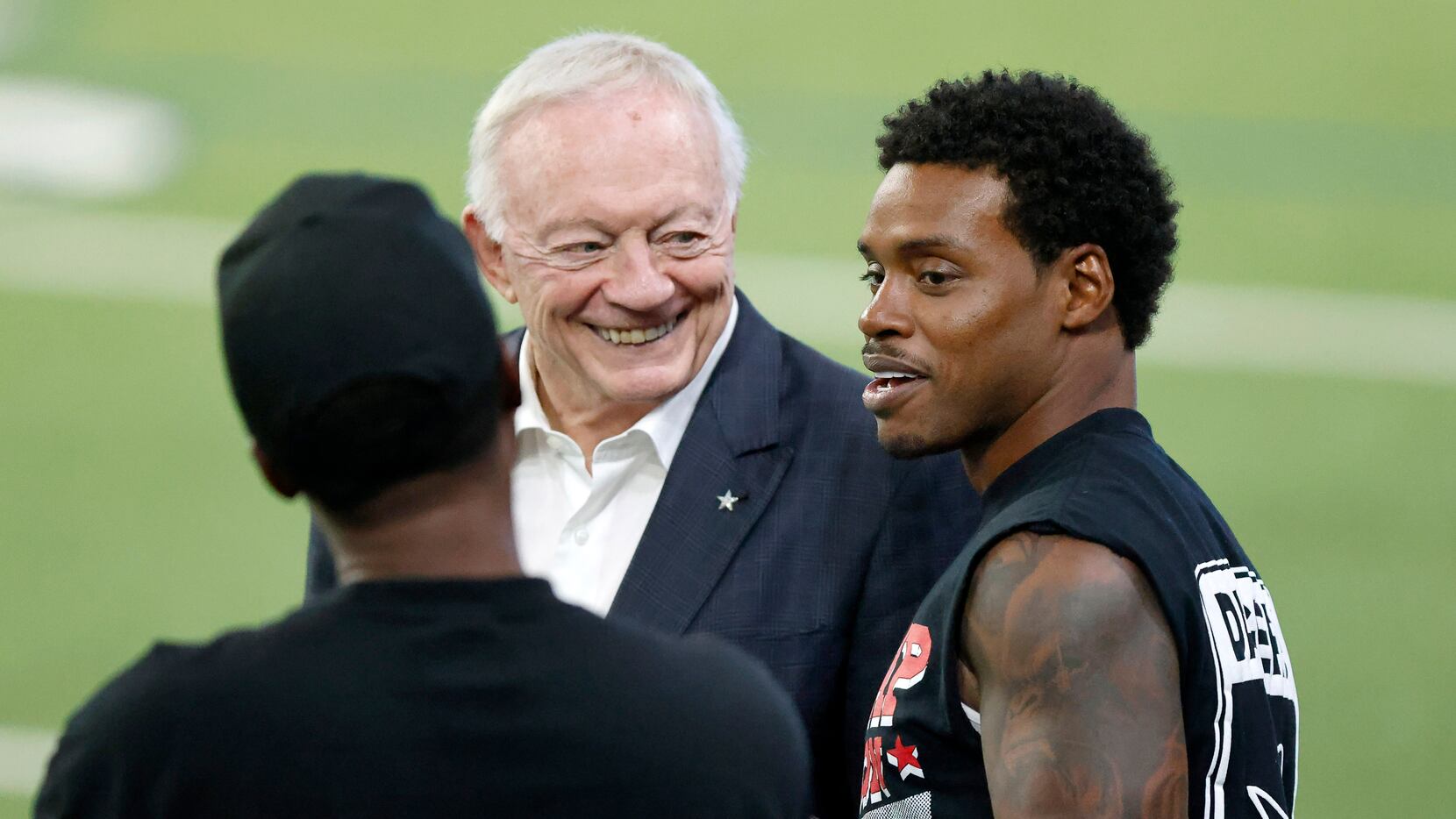 Dallas Cowboys owner Jerry Jones (center) visits with professional boxer Errol Spence Jr. of...