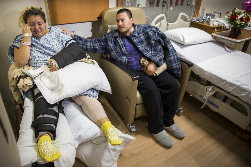 Jose Santillano comforts his wife Zuleyma as they recount the night when a tornado struck...