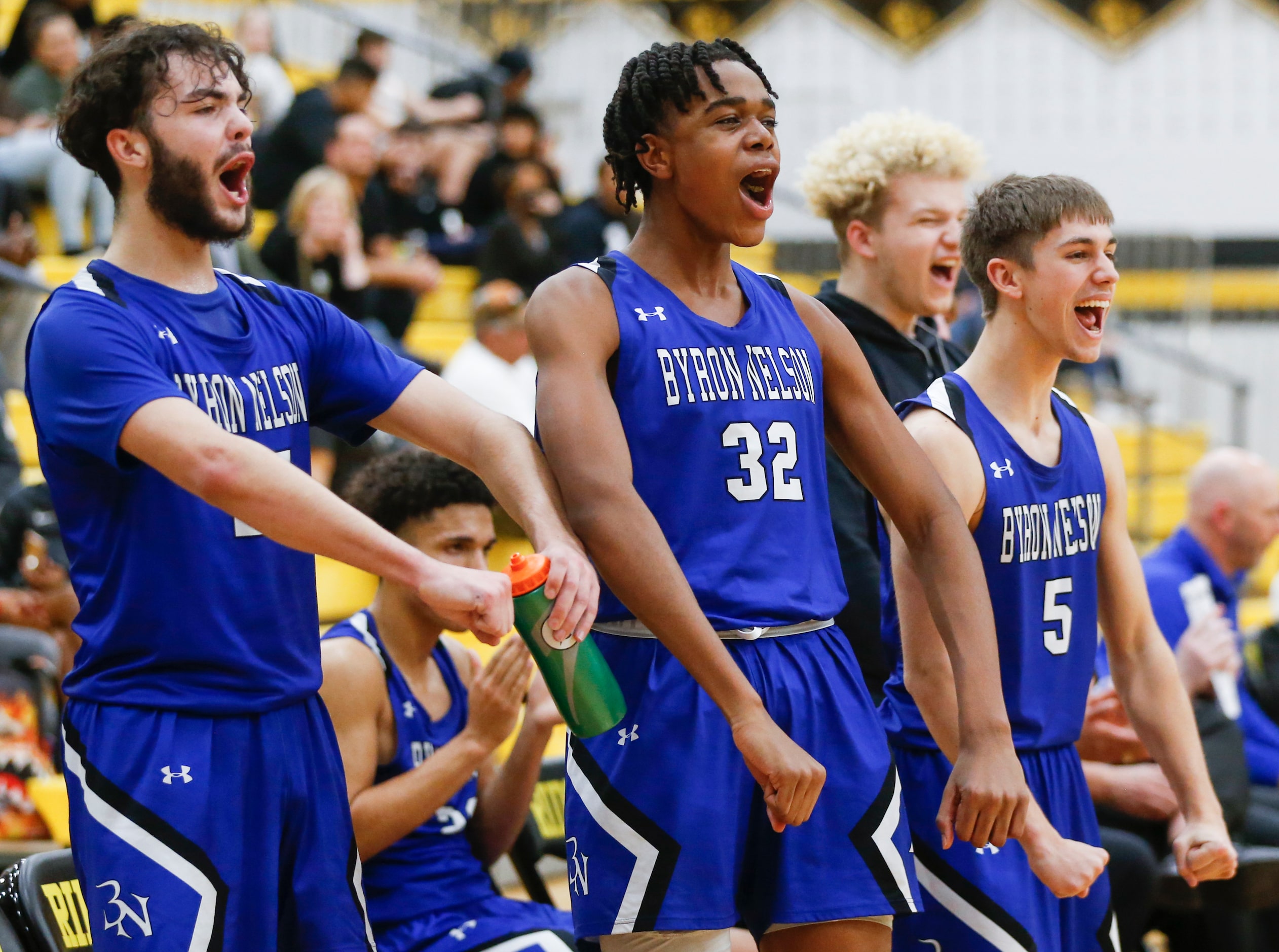 Byron Nelson High School Conner Lindsey (25), Byron Nelson High School David Iweze (32) and...