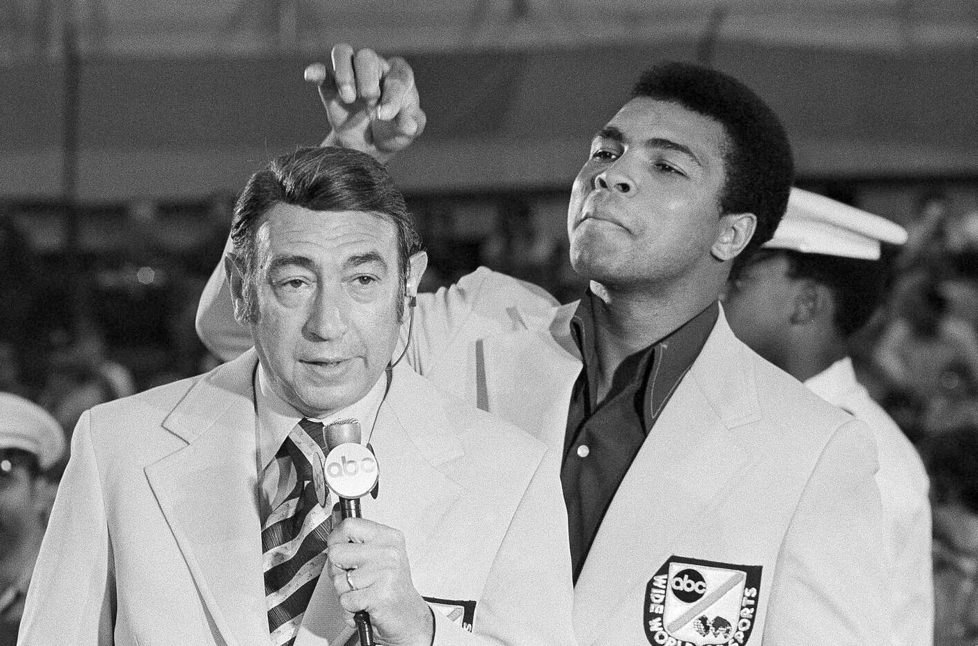 In this Aug. 7, 1972, file photo, Muhammad Ali jokes with television sports commentator ...