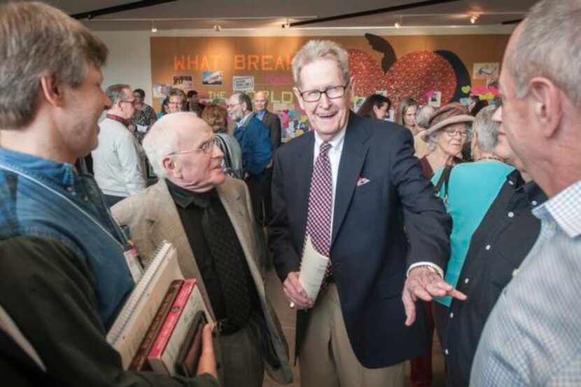 
George Harris (center left) and partner Jack Evans talked with other members of Northaven...