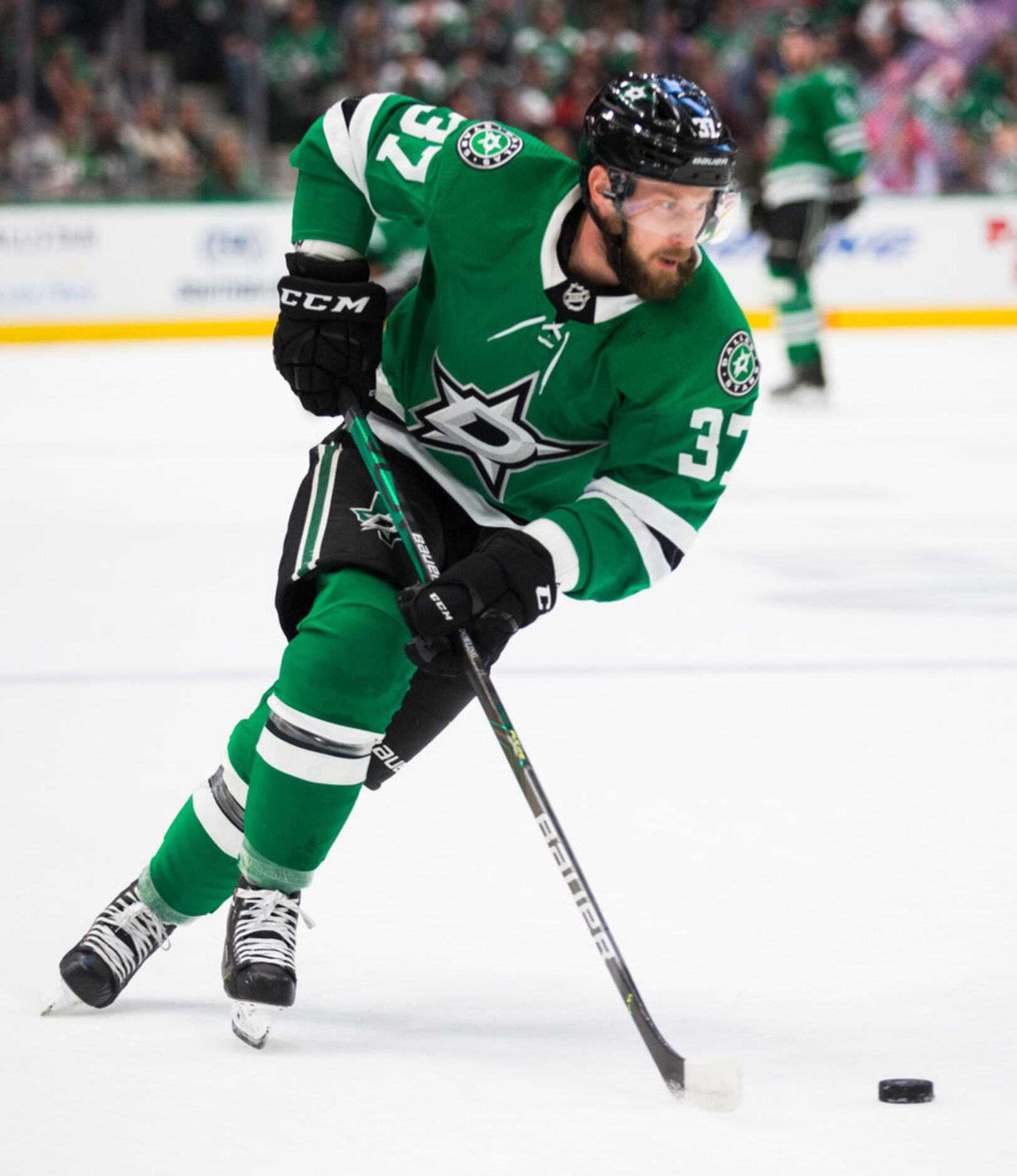 Dallas Stars center Justin Dowling (37) skates during the first period of an NHL game...