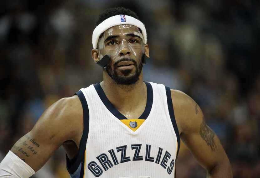 FILE - This May 9, 2015, file photo shows Memphis Grizzlies guard Mike Conley (11) walking...