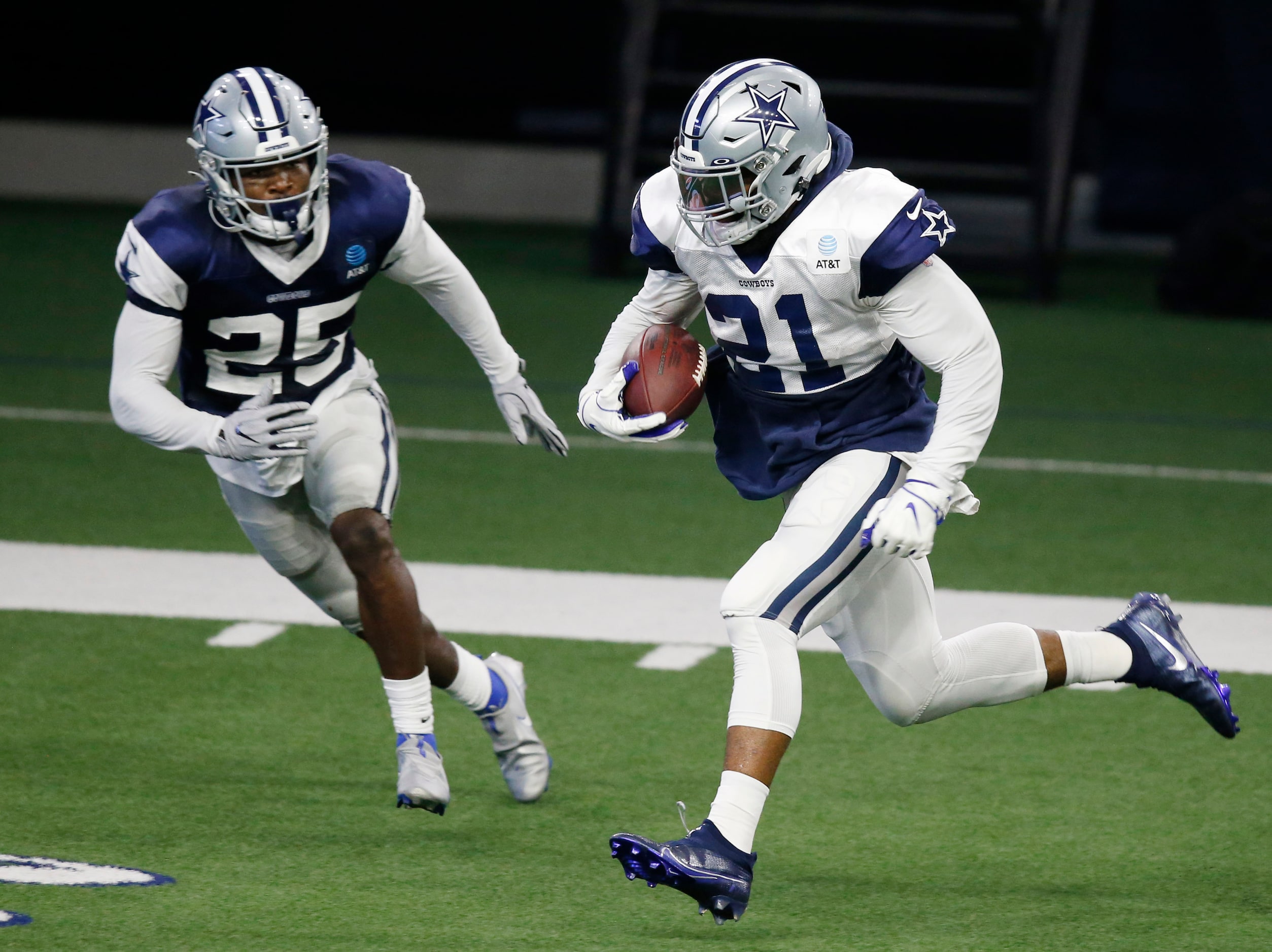 Dallas Cowboys running back Ezekiel Elliott (21) runs up the field as Dallas Cowboys safety...