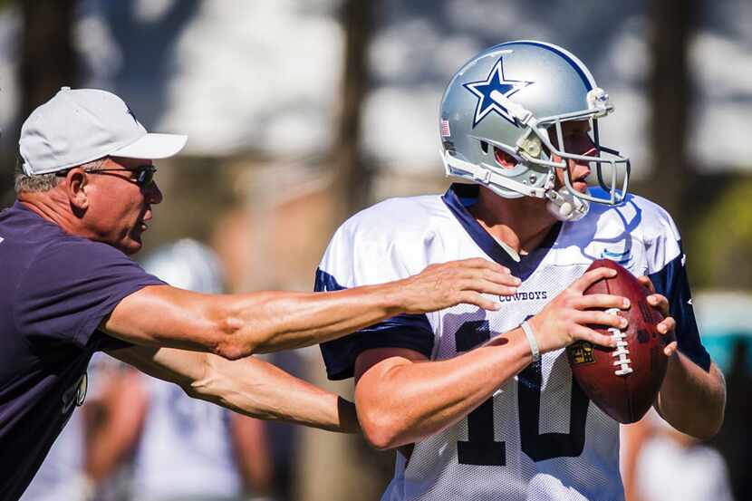 Dallas Cowboys quarterbacks coach Wade Wilson works with quarterback Dustin Vaughan (10)...
