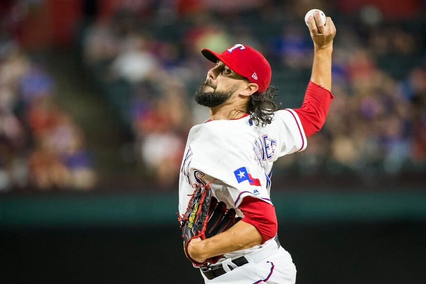 Texas Rangers relief pitcher Tony Barnette pitches during the eighth inning of a 9-3 victory...
