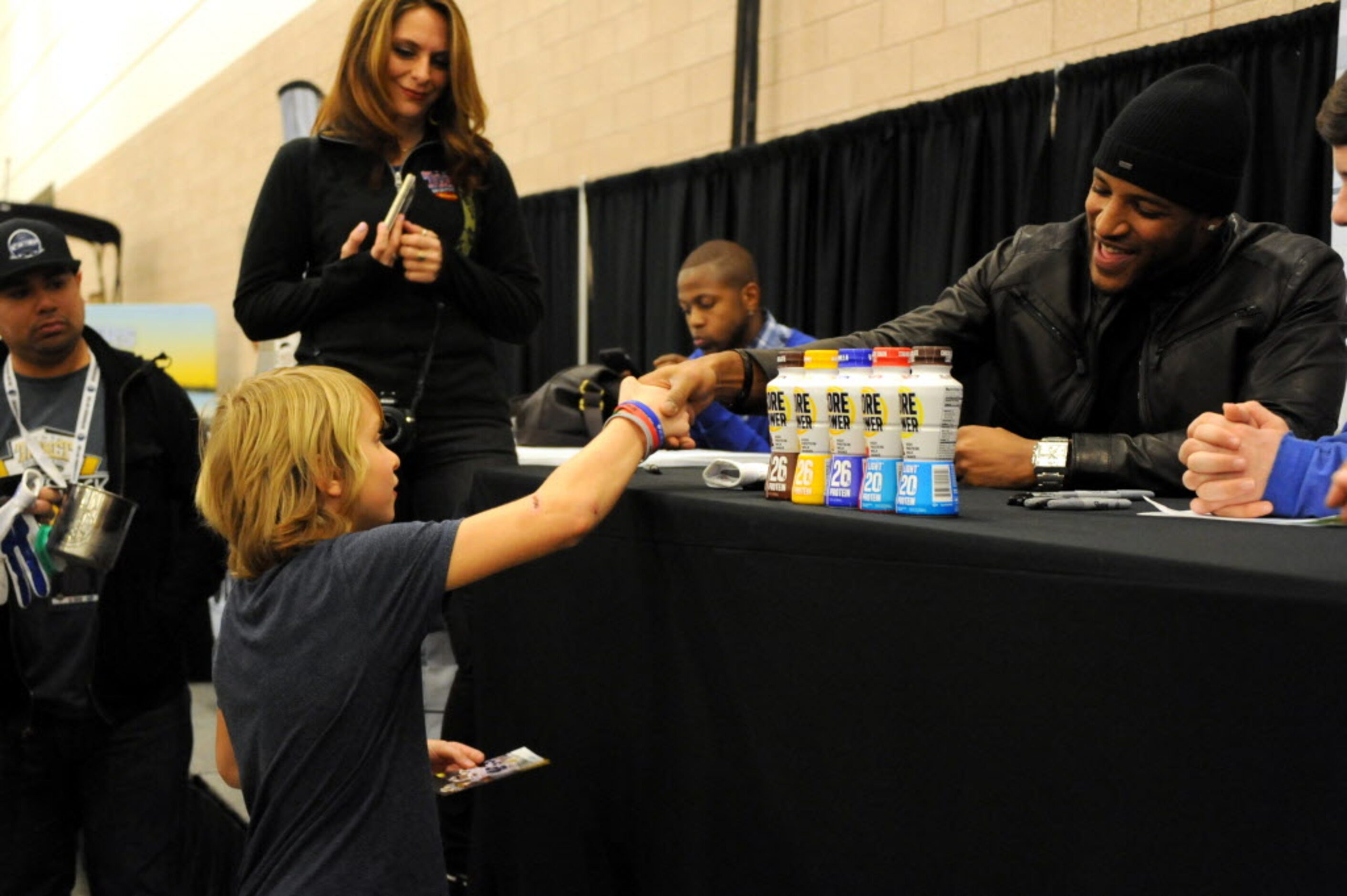 Dallas Cowboys strong safety Barry Church shakes the hand of a fan at The Ticket Sportsradio...