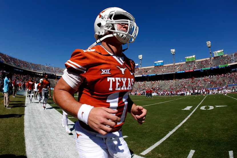 FILE - In this Saturday, Oct. 14, 2017, file photo, Texas quarterback Sam Ehlinger (11) runs...