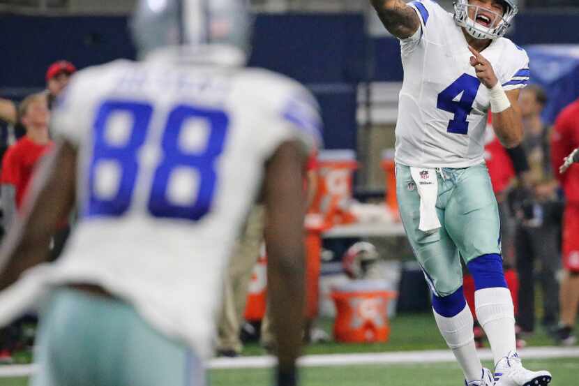 Dallas Cowboys quarterback Dak Prescott (4) passes to wide receiver Dez Bryant (88) in the...