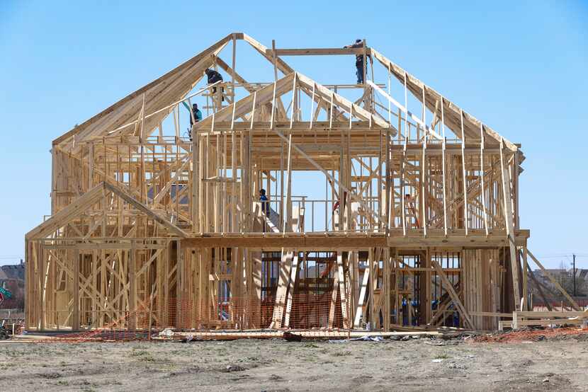 The frame of a new home is shown in Frisco. Tanya O’Neil, a Realtor who works in growing...