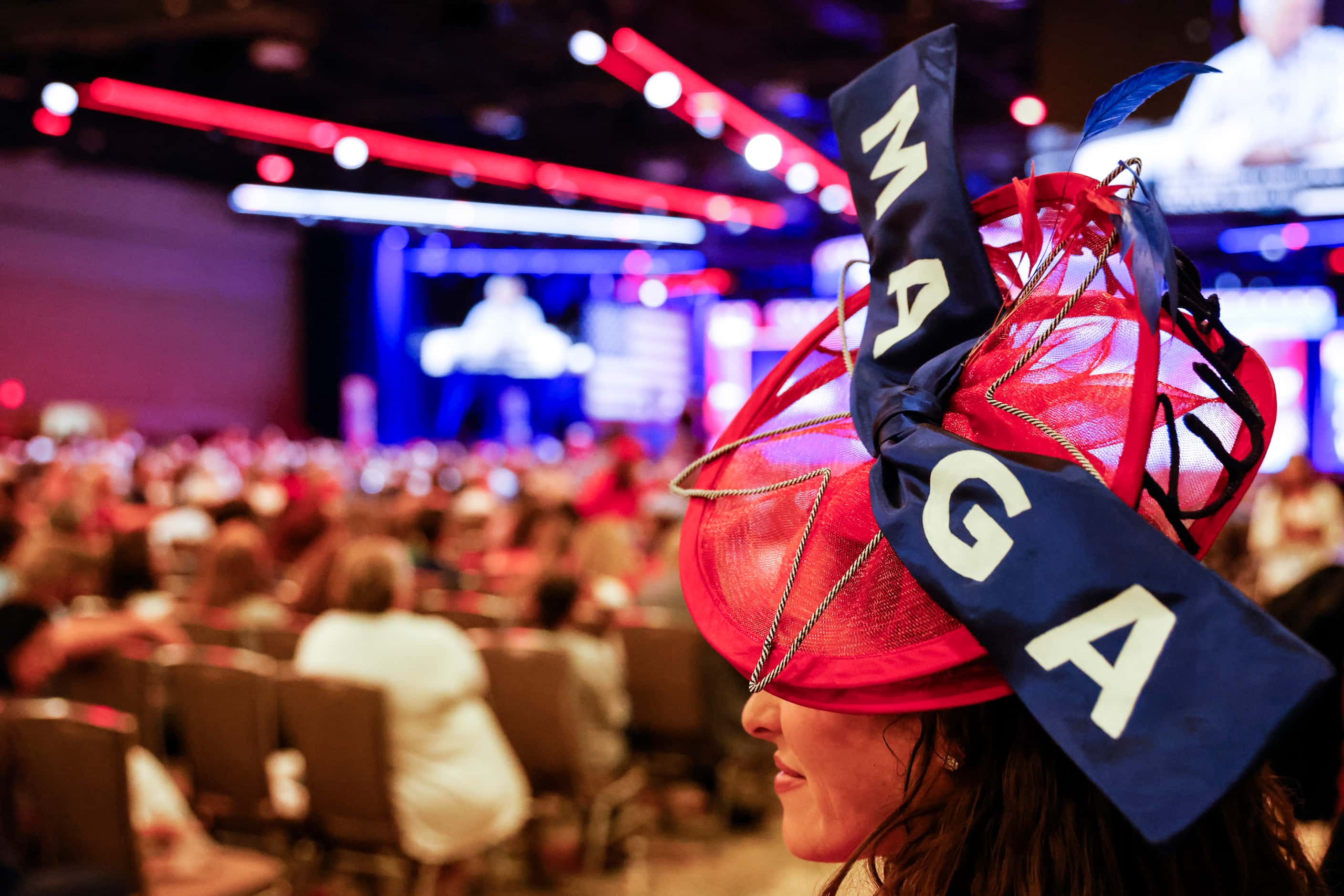 Attendee Meghan Anderson wearing a MAGA designed hat watches the third day of Conservative...