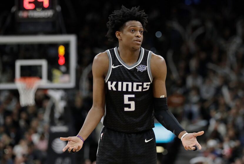 Sacramento Kings guard De'Aaron Fox (5) reacts after a play during the second half of an NBA...