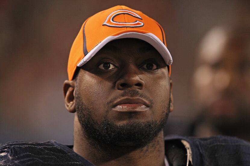 Henry Melton #69 of the Chicago Bears watches as his teammates take on the Buffalo Bills...