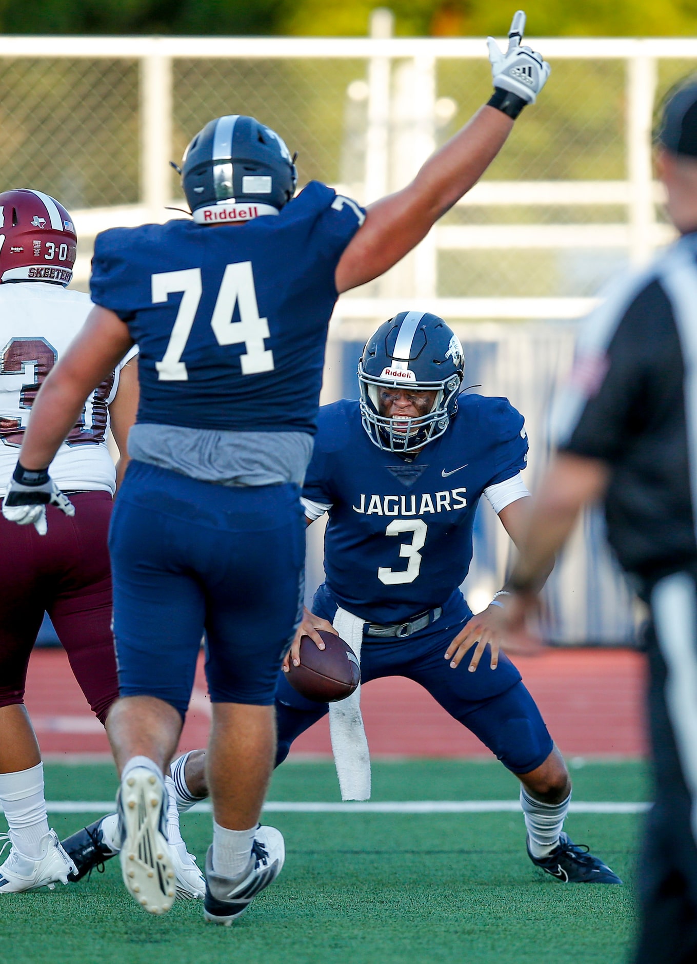 Flower Mound senior quarterback Nick Evers (3) is congratulated by senior offensive lineman...