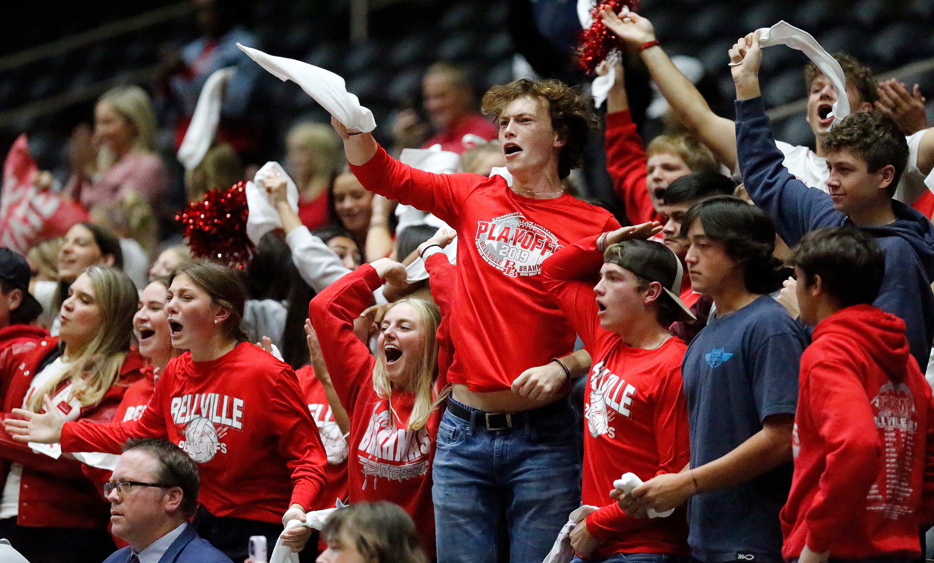 The Bellville High School student section celebrates the win after game one as Aubrey High...