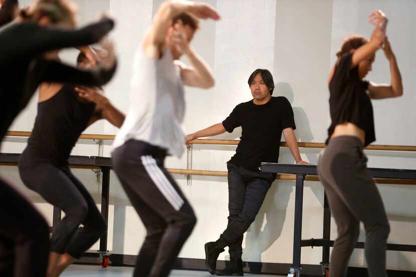 Takehiro Ueyama, a visiting artistic director/choreographer, watches as dancers from Dallas...