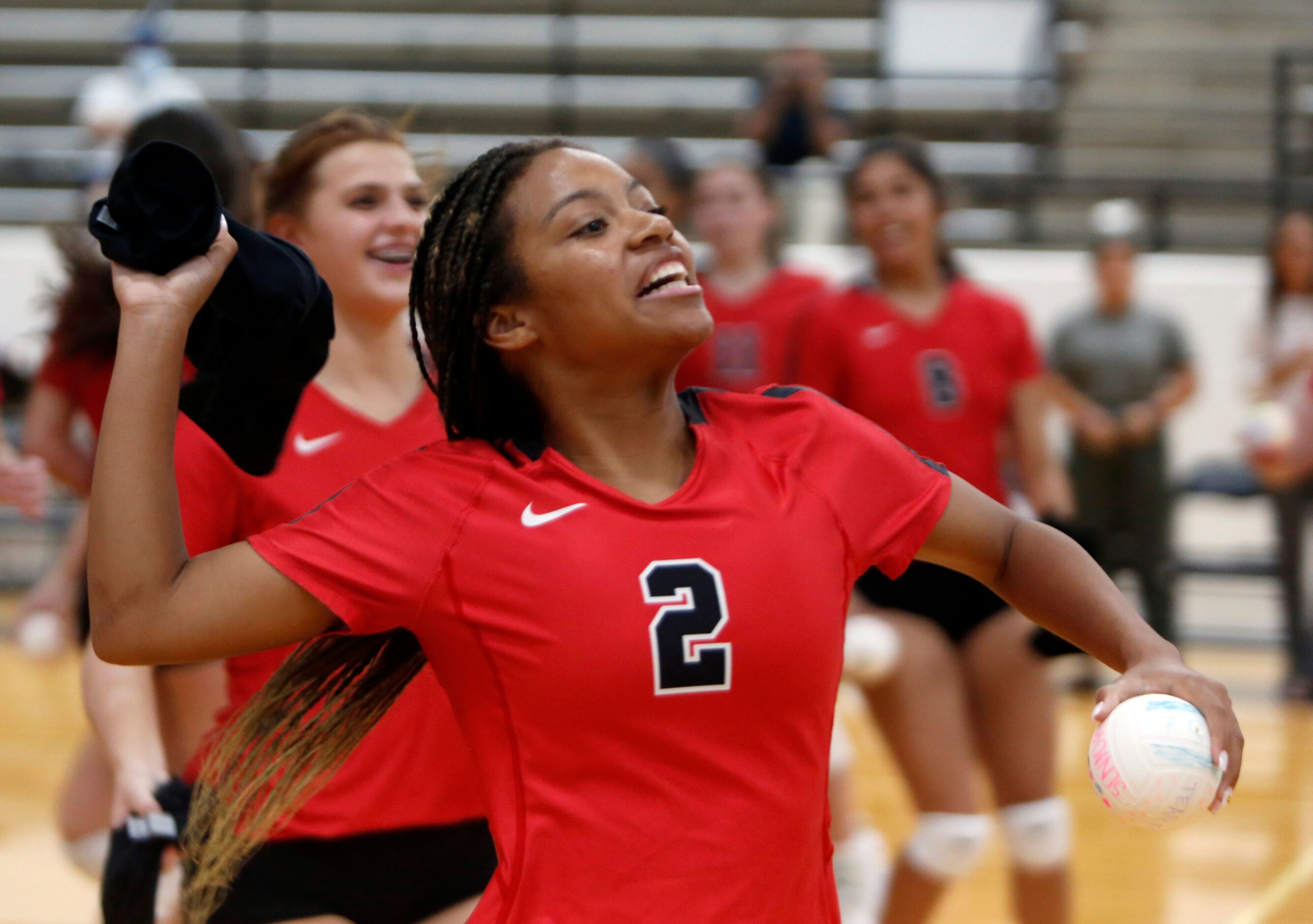 Arlington Martin's Aubrey Wright (2) prepares to launch a t-shirt into the crowd following...