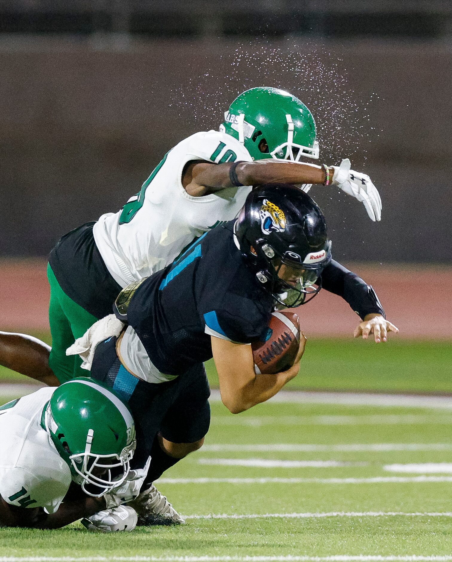 Bryan Adams cornerback Dedran Williamson (10) and defensive back Camran Savage (14) tackle...