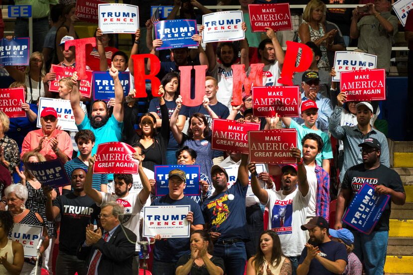 Supporters of Republican presidential candidate Donald Trump cheer during a rally at the...