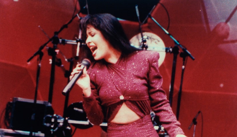 Here, Selena is shown performing in concert one month before her death.