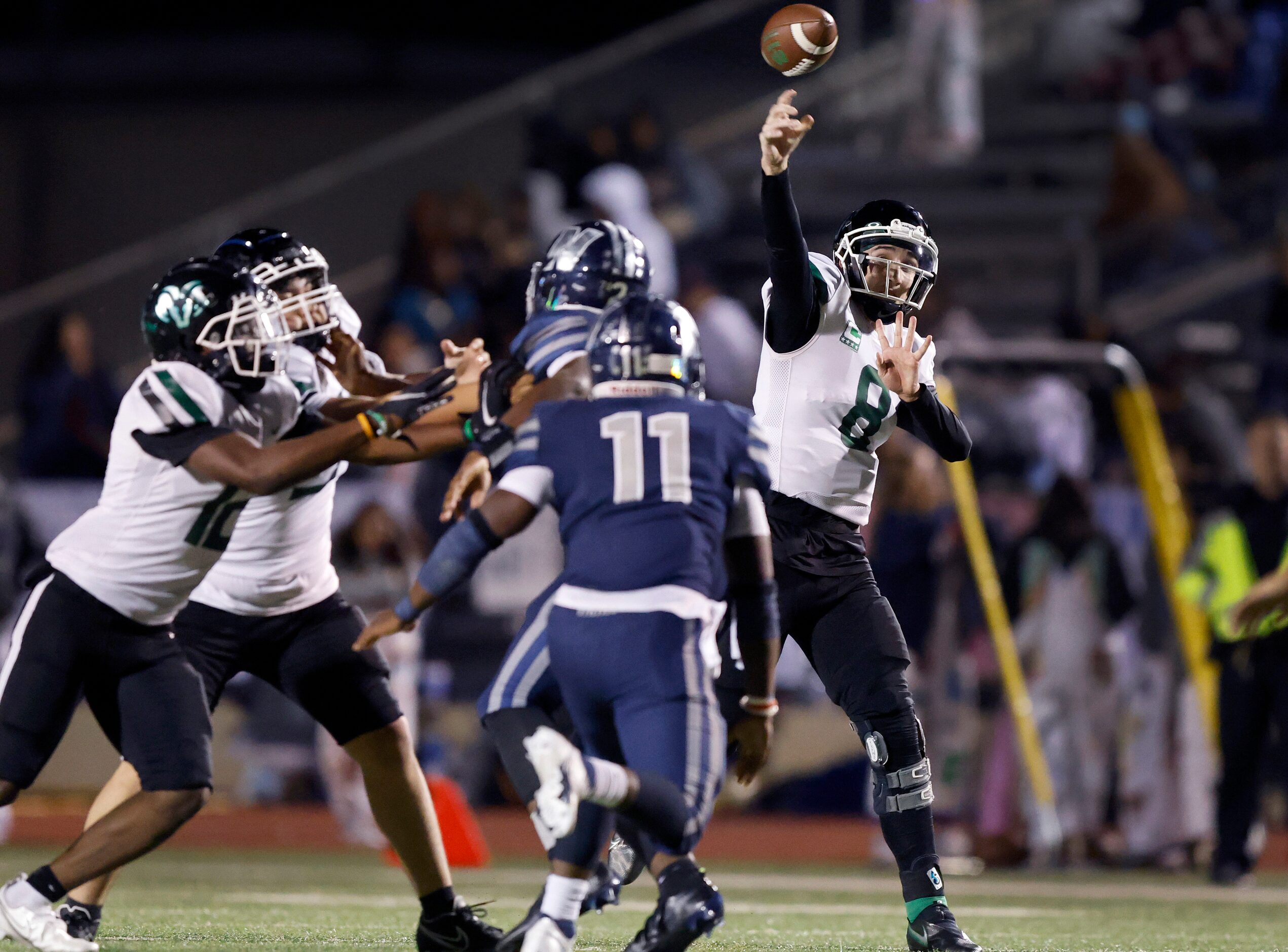 Richardson Berkner quarterback Thomas Landry (8, right) throws a deep second quarter pass...