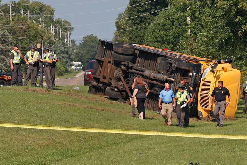 Authorities work on the scene of a bus crash in Lawrenceville, Ohio, Aug. 22, 2023.